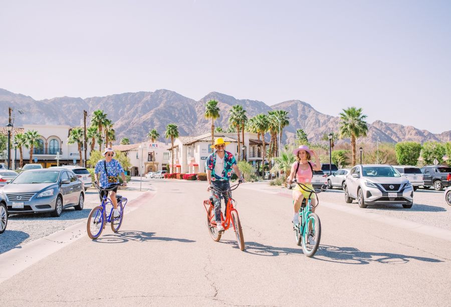 Friends bike around La Quinta, a popular activity for sightseeing and exploring the area.